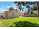 Private backyard featuring lush greenery and mature trees, offering a peaceful retreat at 289 Garwood Ct, Henderson, NV 89074