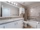 Granite vanity and a large mirror highlight this bathroom's modern design and functionality at 289 Garwood Ct, Henderson, NV 89074