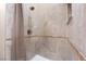 Tiled shower features a beige tile surround with built-in niche and modern shower head at 289 Garwood Ct, Henderson, NV 89074
