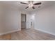 This bedroom features wood-look tile floors, a ceiling fan, a closet, and neutral walls at 289 Garwood Ct, Henderson, NV 89074
