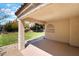 Covered patio offers a relaxing outdoor space with a view of the landscaped backyard at 289 Garwood Ct, Henderson, NV 89074