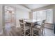 Cozy dining area featuring stylish seating, a bright window, and seamless access to the kitchen at 289 Garwood Ct, Henderson, NV 89074