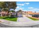 Charming home exterior with a spacious driveway and well-maintained landscaping at 289 Garwood Ct, Henderson, NV 89074