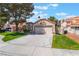 Attractive single-story home with a wide driveway and manicured front yard at 289 Garwood Ct, Henderson, NV 89074