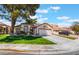 Charming single-story home with well-manicured lawn, mature trees, and spacious driveway, in a desirable neighborhood at 289 Garwood Ct, Henderson, NV 89074