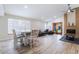 Bright, open-concept living room with a fireplace, dining area, and elegant furnishings at 289 Garwood Ct, Henderson, NV 89074