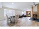 Open-concept living space with hardwood floors, brick fireplace, stylish furnishings, and ample natural light at 289 Garwood Ct, Henderson, NV 89074