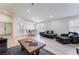 Spacious living area with a dining table, comfortable seating, and large windows providing plenty of light at 289 Garwood Ct, Henderson, NV 89074
