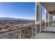 Expansive city view from a high-rise balcony with modern railing, showcasing a clear, sunny sky at 4381 W Flamingo Rd # 5502, Las Vegas, NV 89103