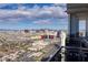Expansive city view from a high-rise balcony with modern railing, showcasing a clear, sunny sky at 4381 W Flamingo Rd # 5502, Las Vegas, NV 89103