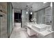 Sleek bathroom with double vanity, marble tiling, and luxurious finishes at 4381 W Flamingo Rd # 5502, Las Vegas, NV 89103