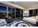 Modern bedroom with floor-to-ceiling windows showcasing city views, complemented by contemporary furnishings and decor at 4381 W Flamingo Rd # 5502, Las Vegas, NV 89103
