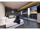 Modern bedroom featuring floor-to-ceiling windows with a beautiful view, stylish decor, and comfortable seating at 4381 W Flamingo Rd # 5502, Las Vegas, NV 89103