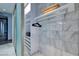 Organized closet with shelving, safe, and rod for hanging clothes at 4381 W Flamingo Rd # 5502, Las Vegas, NV 89103