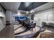 Open-concept dining room and kitchen with stylish black dining set and modern white cabinetry at 4381 W Flamingo Rd # 5502, Las Vegas, NV 89103