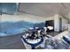 Open game room with poker table, mural, and ample seating at 4381 W Flamingo Rd # 5502, Las Vegas, NV 89103