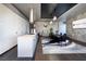 Modern kitchen featuring white cabinets, a spacious island, and an open dining area with stylish accents at 4381 W Flamingo Rd # 5502, Las Vegas, NV 89103
