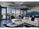 Modern living room features a stylish sectional, floor-to-ceiling windows with cityscape views, and chic decor at 4381 W Flamingo Rd # 5502, Las Vegas, NV 89103
