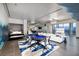 Open concept living room showcasing sleek tile flooring, a modern sectional, and a Murphy bed at 4381 W Flamingo Rd # 5502, Las Vegas, NV 89103