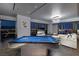 Spacious living room featuring a pool table, modern decor, and stunning city views through expansive windows at 4381 W Flamingo Rd # 5502, Las Vegas, NV 89103
