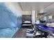 Open-concept living area with a Murphy bed, poker table, and modern decor at 4381 W Flamingo Rd # 5502, Las Vegas, NV 89103