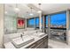 Luxurious bathroom with double sinks, marble counters, and stunning city views at 4471 Dean Martin Dr # 1707, Las Vegas, NV 89103