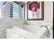 Elegant marble bathtub offering city views and a spa-like experience at 4471 Dean Martin Dr # 1707, Las Vegas, NV 89103