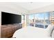Bright bedroom with a large dresser with tv and a great view of the city at 4471 Dean Martin Dr # 1707, Las Vegas, NV 89103