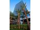 Exterior of The Martin building and sign with palm trees and lush landscaping at 4471 Dean Martin Dr # 1707, Las Vegas, NV 89103