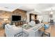 Modern living room featuring a stone accent wall and comfortable seating arrangement at 4471 Dean Martin Dr # 1707, Las Vegas, NV 89103