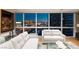 Chic living area boasts plush seating, modern accents, and breathtaking views of the city skyline at night at 4471 Dean Martin Dr # 1707, Las Vegas, NV 89103