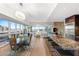 Open-concept living area with modern furnishings, sleek kitchen, and floor-to-ceiling windows with city views at 4471 Dean Martin Dr # 1707, Las Vegas, NV 89103