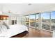Bright main bedroom with floor-to-ceiling windows boasting expansive city views and a ceiling fan at 4471 Dean Martin Dr # 1707, Las Vegas, NV 89103