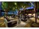 Serene outdoor lounge area with stylish furniture and ambient lighting, surrounded by lush greenery at 4471 Dean Martin Dr # 1707, Las Vegas, NV 89103