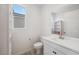 Bright bathroom features modern fixtures, a white vanity, and ample natural light from the window at 4557 E Cactus Canyon Dr, Pahrump, NV 89061