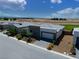 A modern one-story home with a two-car garage and nicely landscaped front yard at 4557 E Cactus Canyon Dr, Pahrump, NV 89061
