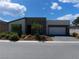 Charming single-story home with a modern exterior and inviting curb appeal at 4557 E Cactus Canyon Dr, Pahrump, NV 89061
