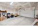 Spacious garage with a roll up door and ample storage space ready for organization and parking vehicles at 4557 E Cactus Canyon Dr, Pahrump, NV 89061