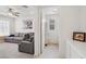 Hallway view showcases the seamless flow between the living area and a tastefully designed bathroom at 4557 E Cactus Canyon Dr, Pahrump, NV 89061