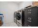 Modern laundry room equipped with stainless steel washer and dryer at 4557 E Cactus Canyon Dr, Pahrump, NV 89061