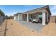 A backyard features brick tiles on a patio that is surrounded by decorative rock and landscaping at 4557 E Cactus Canyon Dr, Pahrump, NV 89061