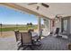 Comfortable outdoor patio featuring stylish furniture, ceiling fans, and scenic golf course views perfect for relaxing at 4557 E Cactus Canyon Dr, Pahrump, NV 89061