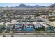 Expansive neighborhood showcasing modern homes nestled against majestic mountains, blending luxury living with natural beauty at 472 Windstone Crest Ave, Las Vegas, NV 89138