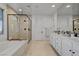 Beautiful bathroom features a soaking tub, tiled shower, and dual vanity sinks at 472 Windstone Crest Ave, Las Vegas, NV 89138