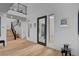Grand entryway with high ceilings, hardwood floors, staircase, and modern design elements at 472 Windstone Crest Ave, Las Vegas, NV 89138
