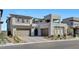 Contemporary two-story home features multi-car garage and professionally landscaped front yard at 472 Windstone Crest Ave, Las Vegas, NV 89138