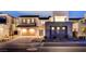A modern two-story home showcases a stylish garage and well-maintained landscaping, set on a paved street at 472 Windstone Crest Ave, Las Vegas, NV 89138