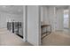 Upstairs hallway with carpet flooring, black railings, and white walls at 472 Windstone Crest Ave, Las Vegas, NV 89138