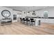 Spacious kitchen features a large island with bar seating, white cabinetry, and hardwood floors at 472 Windstone Crest Ave, Las Vegas, NV 89138