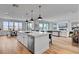 Bright kitchen with stainless steel appliances, center island, and open concept layout with a dining area at 472 Windstone Crest Ave, Las Vegas, NV 89138